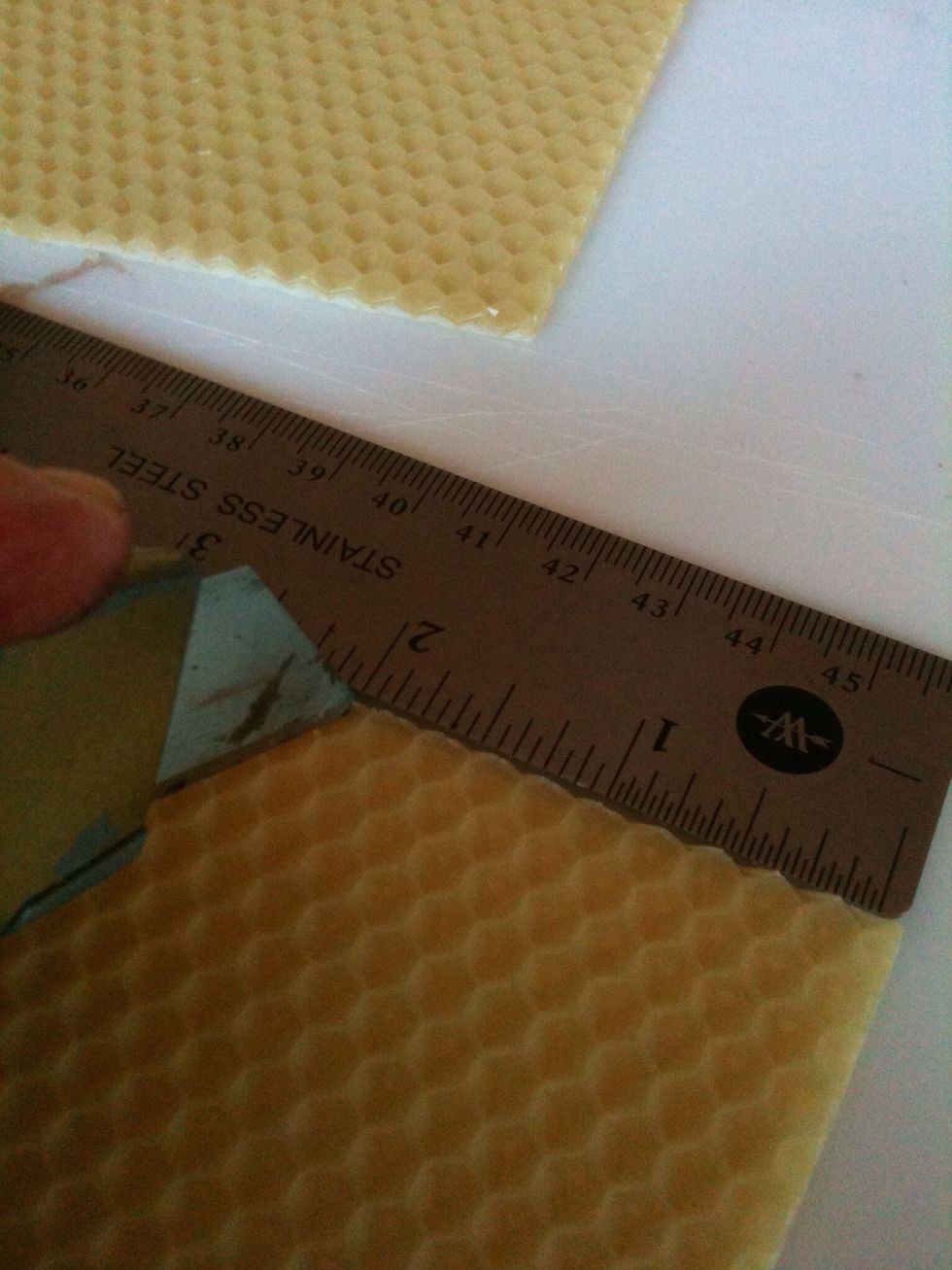 At the top edge, measure 2 inches in (to the left) from the right corner and mark with a small slit.