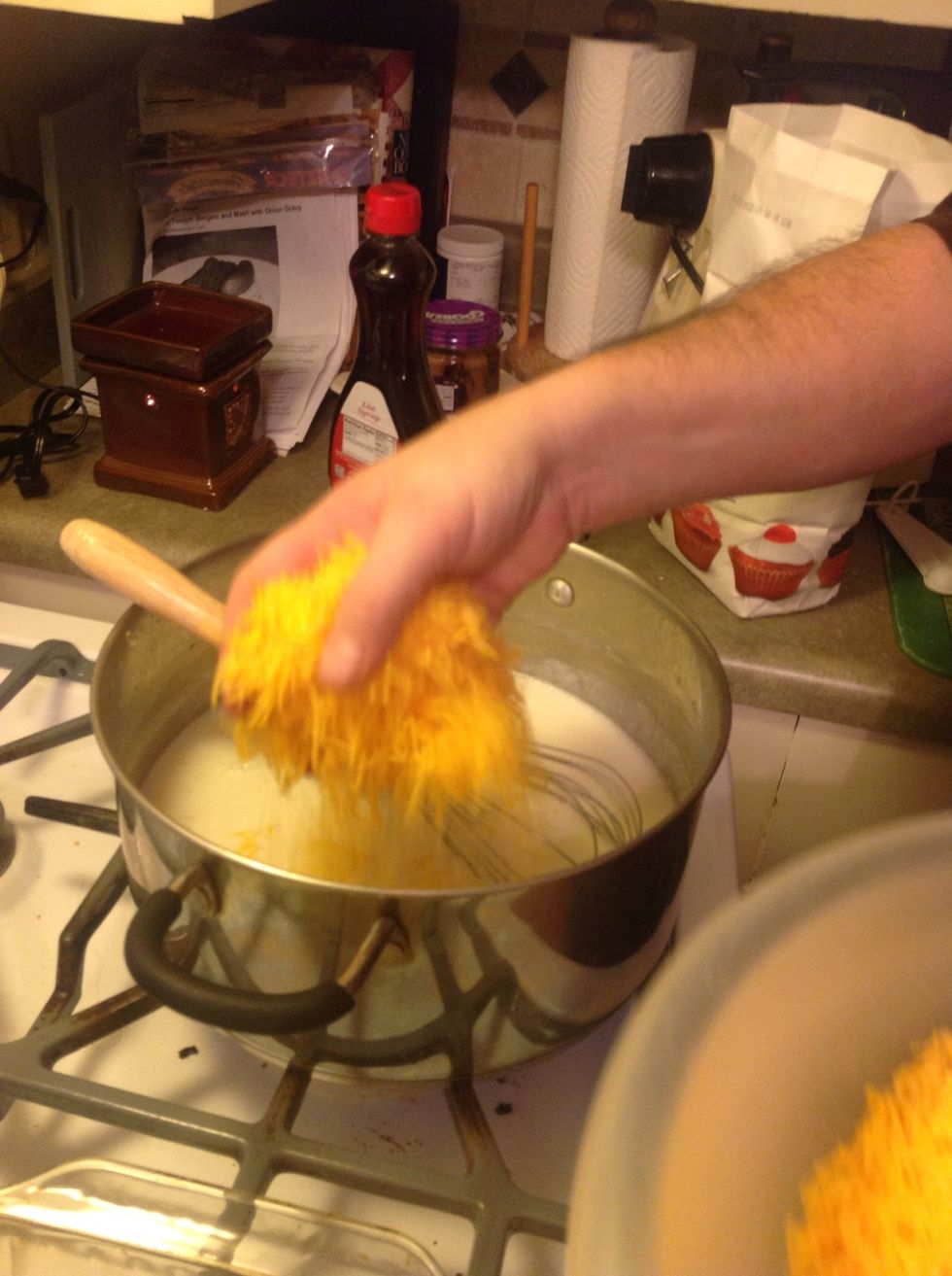 At this point, add the remaining cheese. Slowly add cheese, stirring constantly.