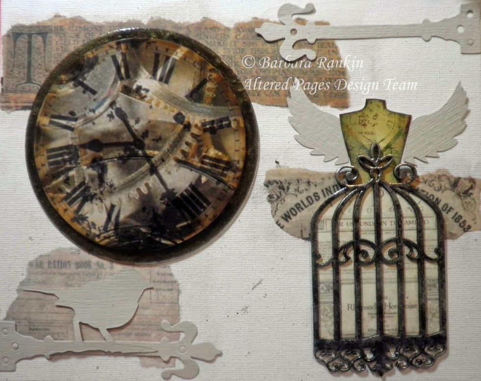 At this point, I decided to place these die cuts of hinge hardware and bird, as shown. I took a photo to remind me where I wanted to place these before moving on to work on my canvas background.