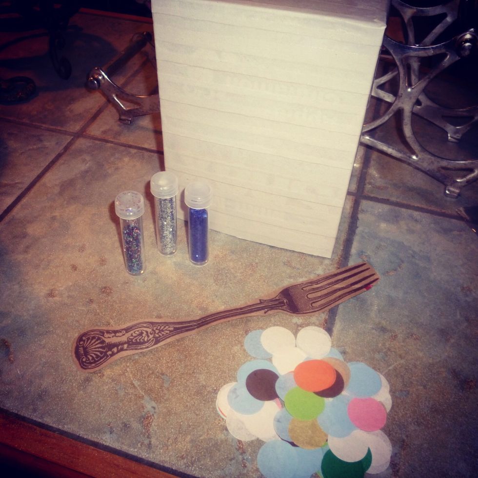 At this point just have fun! I added a coat of white paint and am now ready to add a design. I'm using glitter, coloured tissue paper & letters/images from old magazines.