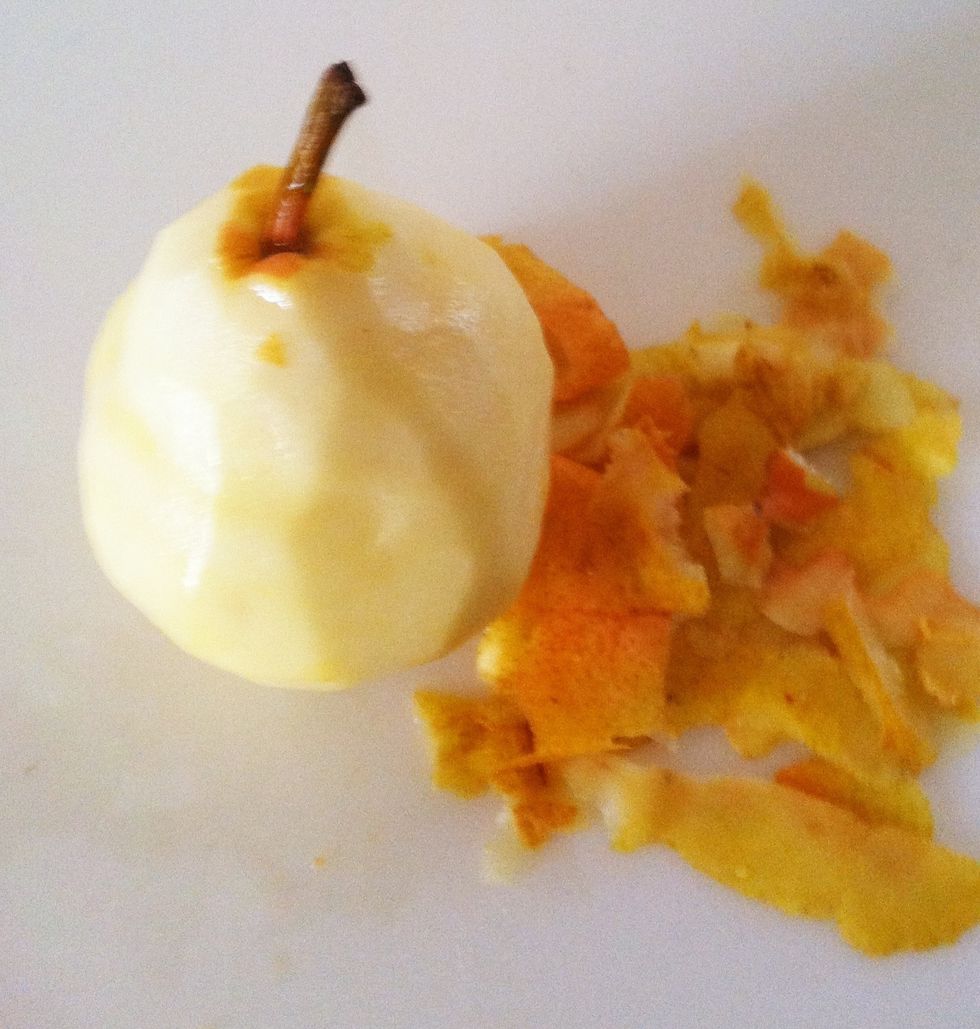 At this point, peel the pear leaving the stem in place. If peeled too early, it may turn brown.