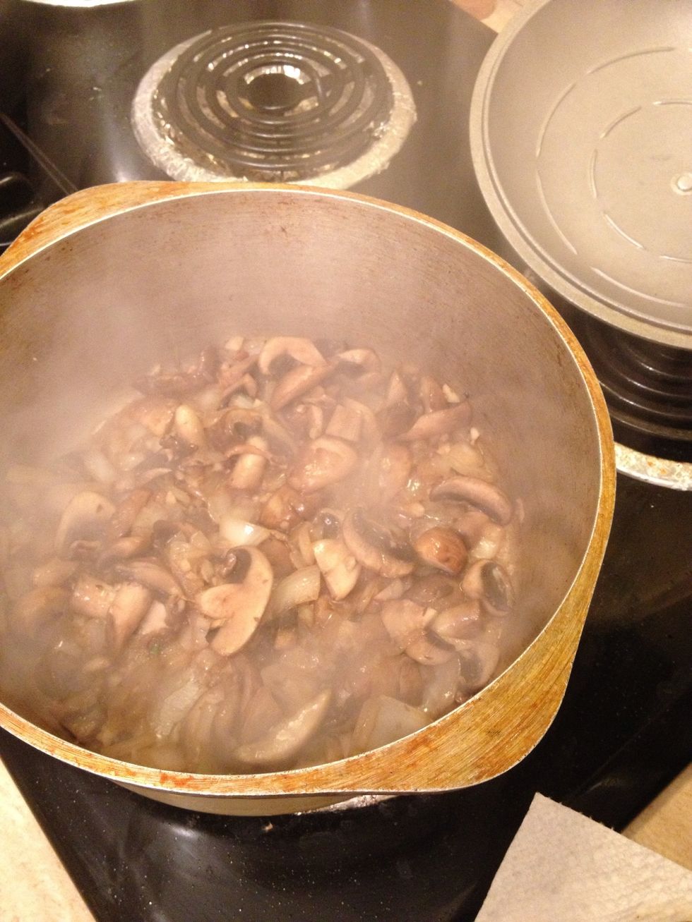 At this point the mushrooms and garlic are translucent and ready for the sauce.