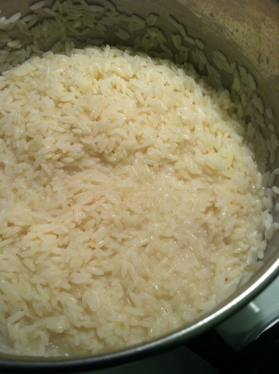 At this point the rice is still in a little but of water. remove from the heated burner to cool burner or cool surface
