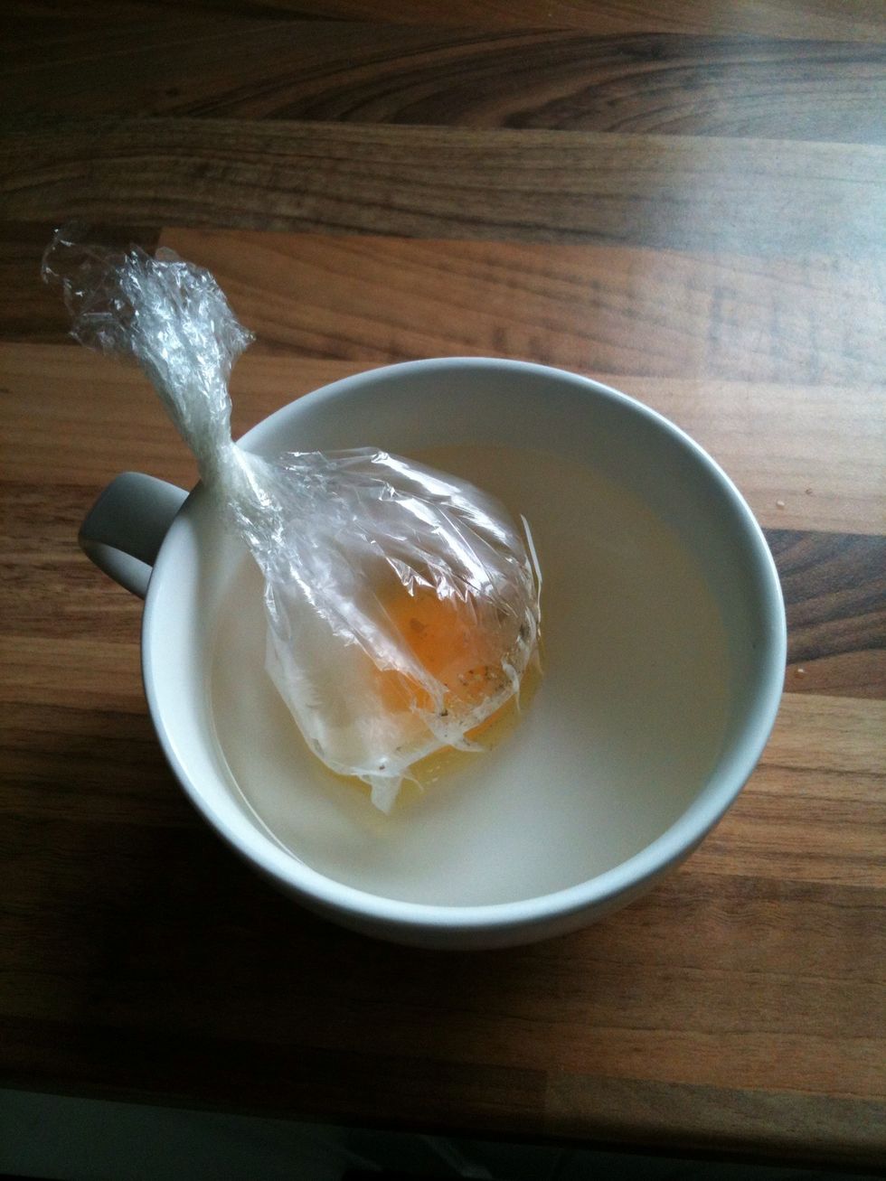 At this point you will be able to see thin parts of the egg white cook as soon as the water hits it. Final check that the egg is sealed in there!