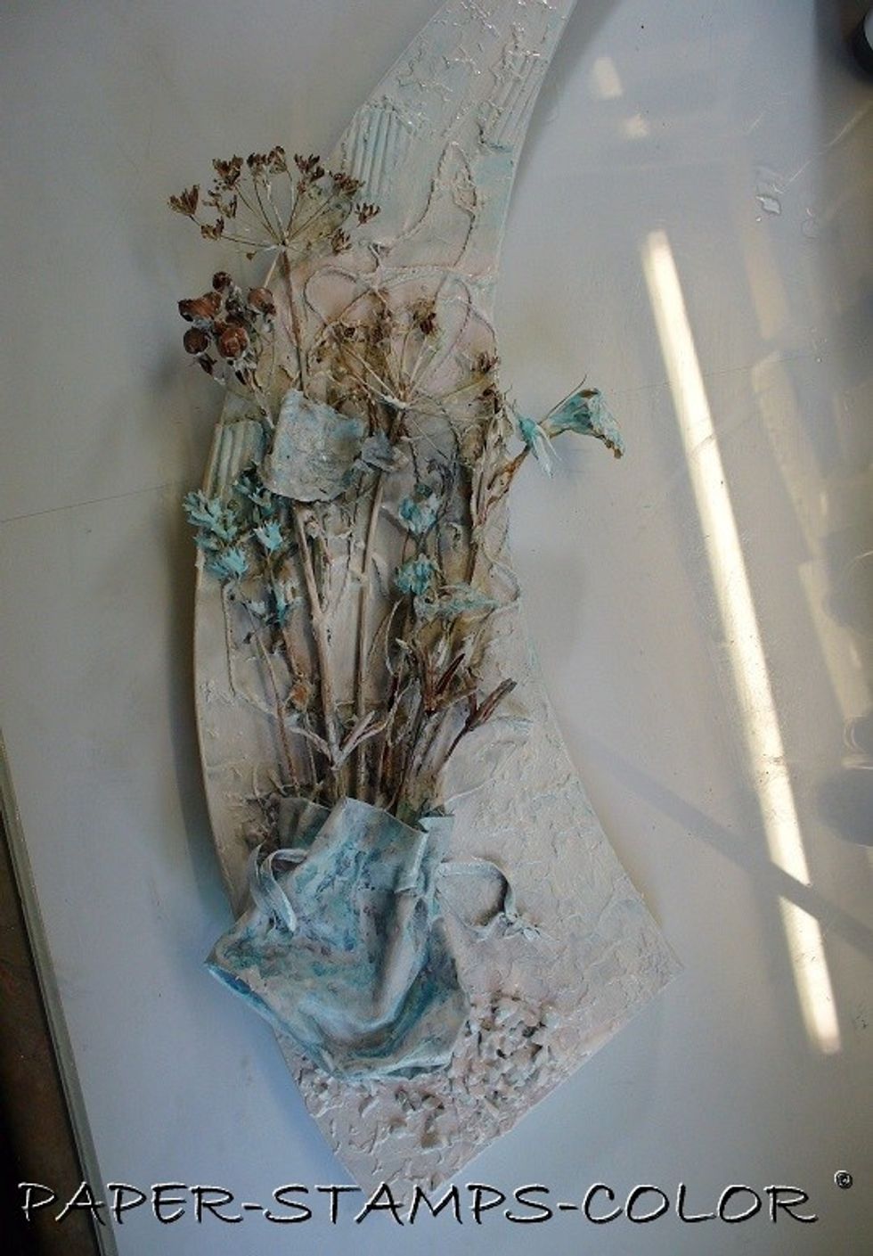 At this stage I decided to mute the colors in the background by ... yes... just adding white watered-down paint over it with a brush. The colors are still peeping through... yes .. that looks better!