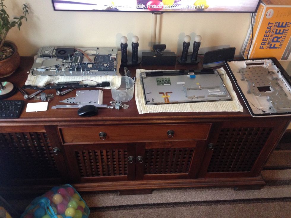 At this stage you will have bits everywhere. Note the board stuck to the back of the LCD was carefully removed using a wallpaper scraper to unglue it, ready to stick to the new panel.