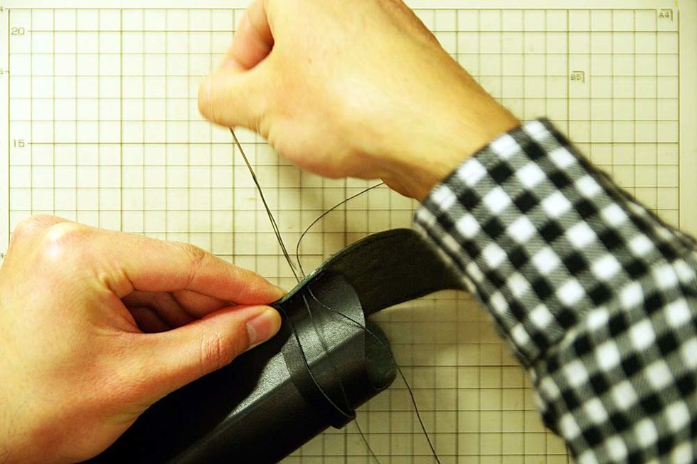 At this time, draw a line on glasses case to make the sewing line. Pierce it with a hammer on the sewing line.