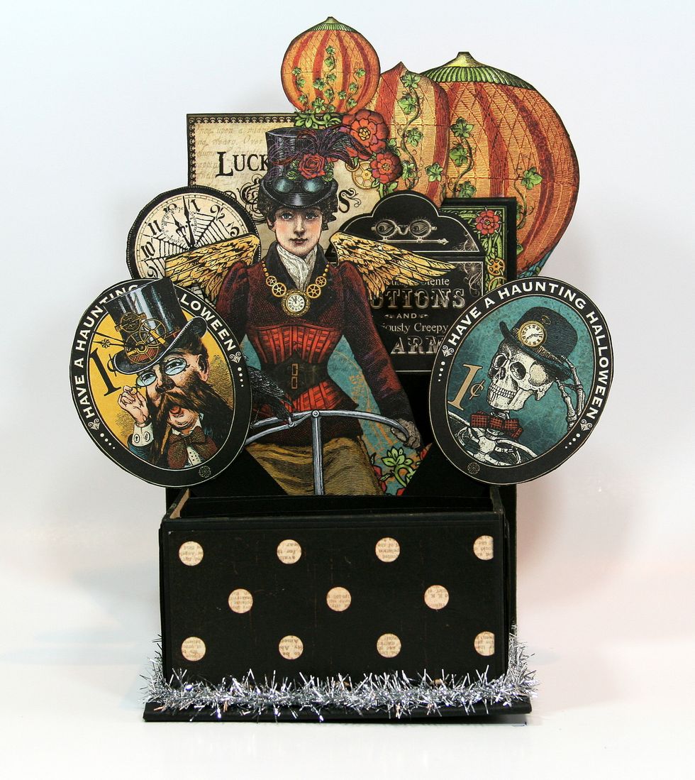 Attach 2 oval frame images. You will want to secure these  black cardstock strips to get the proper angle.