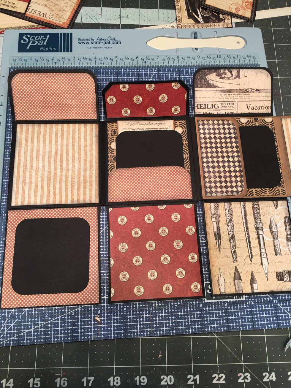 Attach 3 5/8" wide x 1 1/2" tall patterned paper for optional pocket, glue to the center upper section as shown in this photo. Cut 3"x3" photo mats and tags out of 2nd 12x12 sheet of black cardstock.