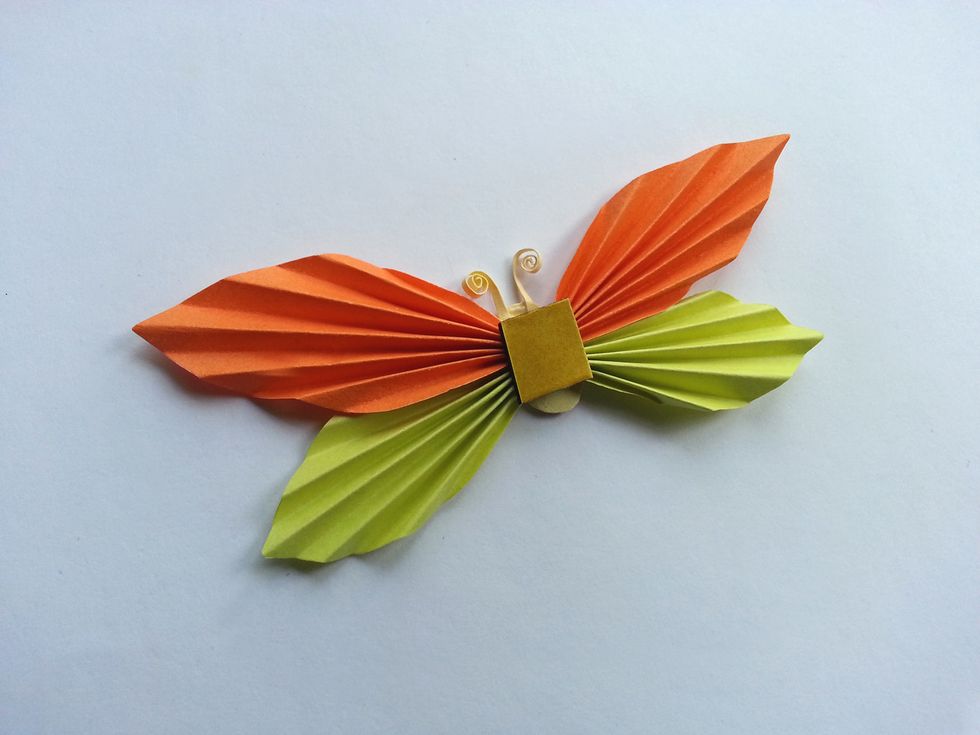 Attach a both side sticky tape on back of the butterfly.