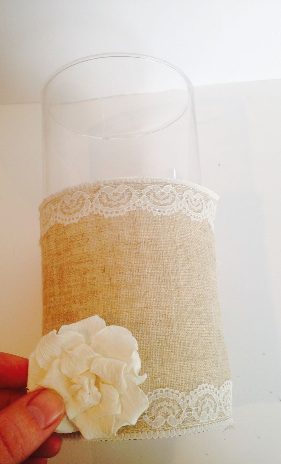Attach a paper flower to the base if the 12 inch votive.