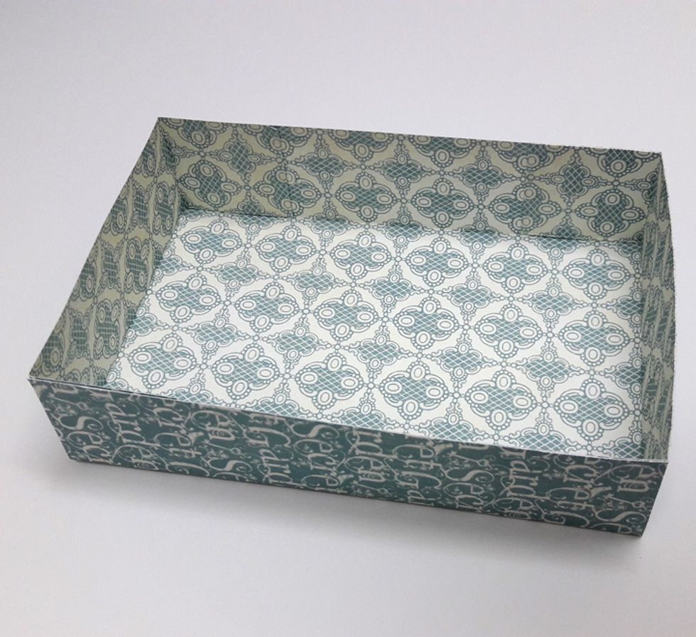 Attach all four corner squares to side walls of box.