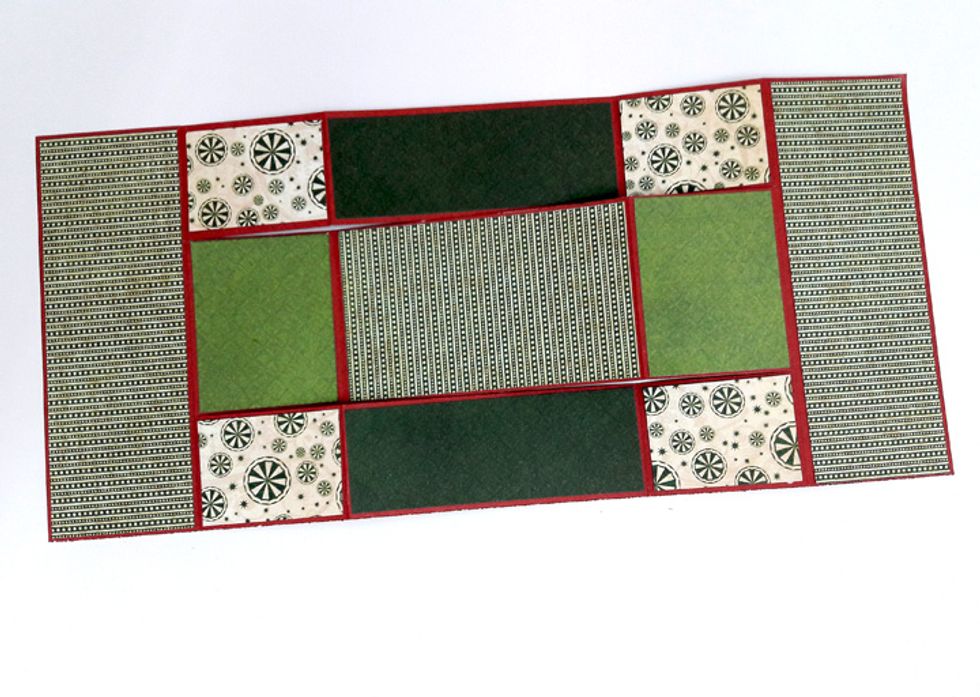 Attach all squares to coordinating panels on card.