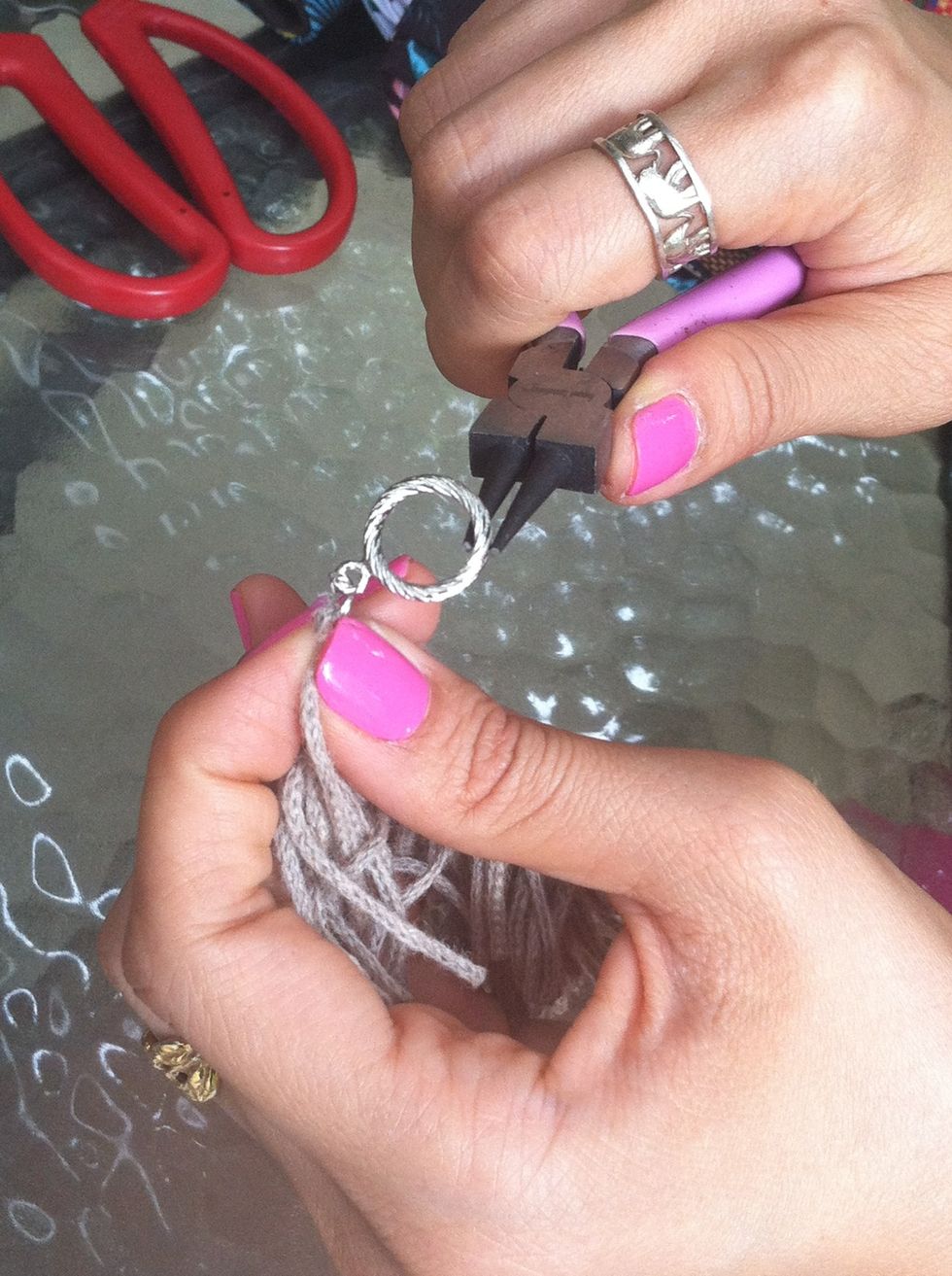Attach another O-ring and the other end of the clasp to the other end of the fringe.