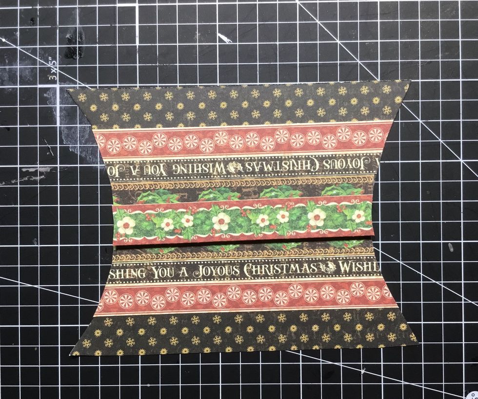 Attach another paper strip as shown. I have attached with 3D dots.