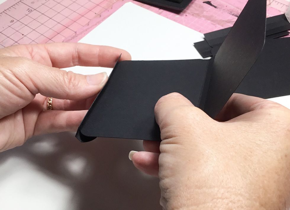 Attach another spine to the other side.