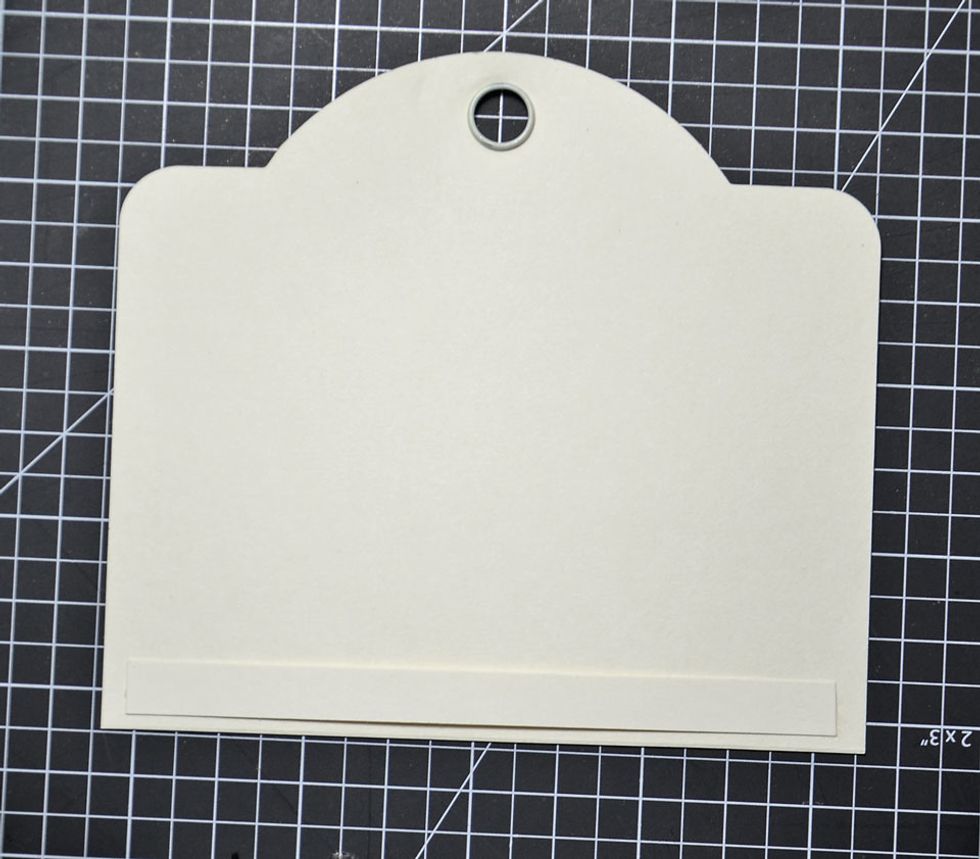 Attach as shown. PLEASE NOTE - only glue the ends of the strip as this is what the small tag will catch onto inside the card.