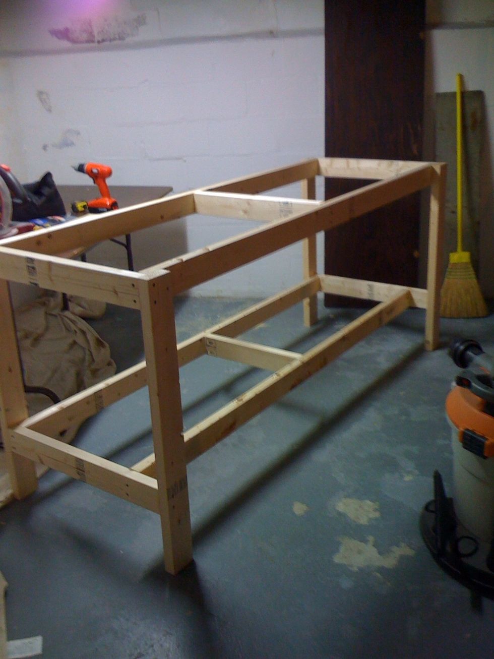 Attach bottom shelf frame at a comfortable level.