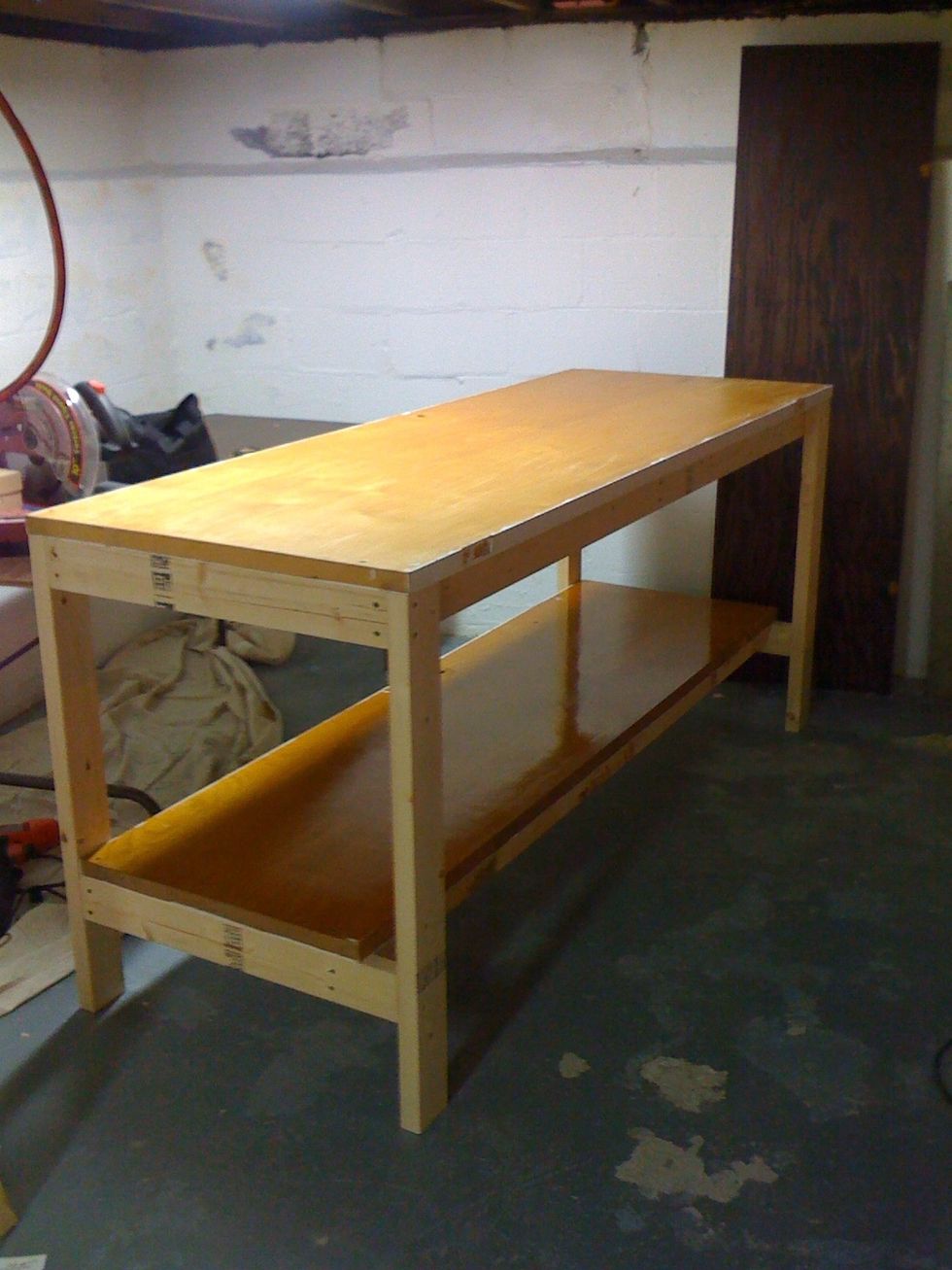 Attach doors to frames. If there is a hole where the door knob was, put that at the back. You could later run power cords thru it.