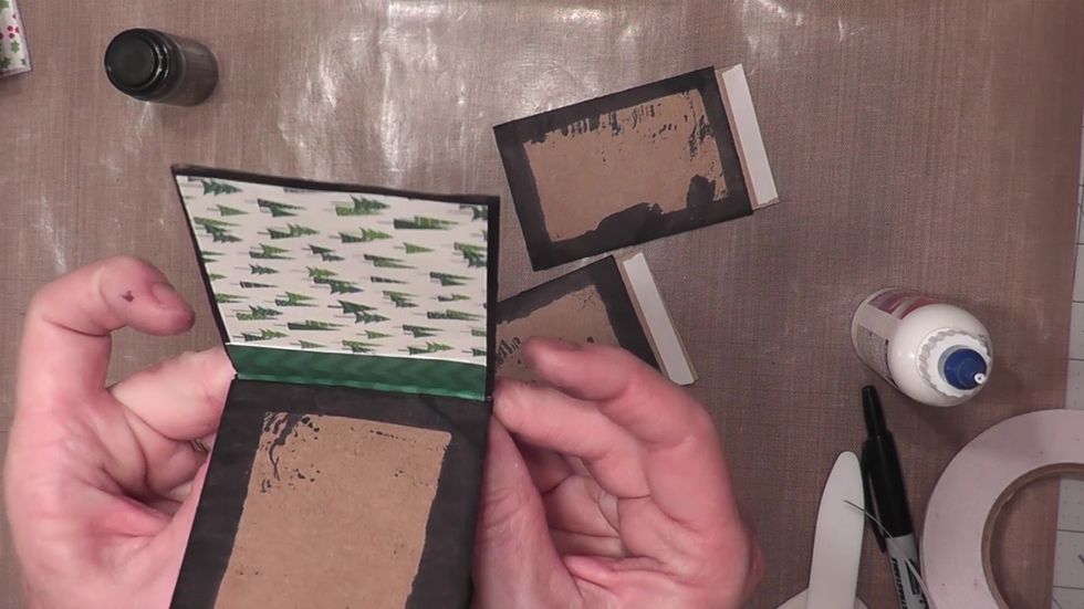 Attach each "page" into the cover of the album between the fold lines, leaving a 1/2" space or gusset between each page.