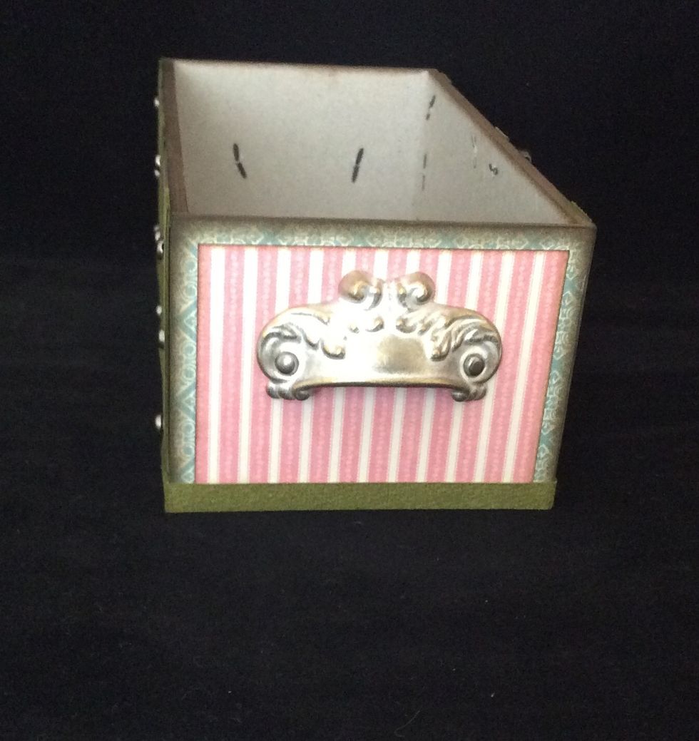 Attach handles to side of trunk.