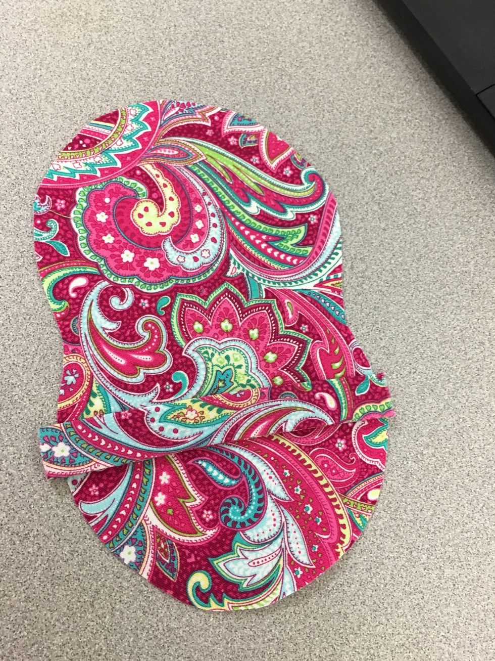 Attach interfacing to the wrong side of the main piece. To construct the holder:  Lay the outside "main piece" face down. Next, lay the rectangular closure on top on the bottom 1/2 of the main piece.