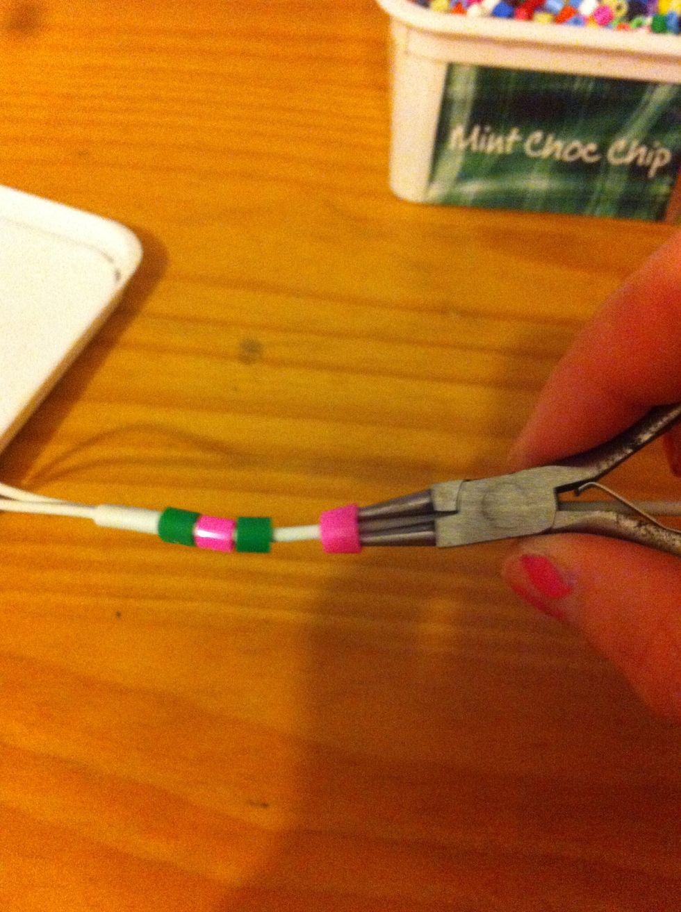 Attach it to the earphones :)