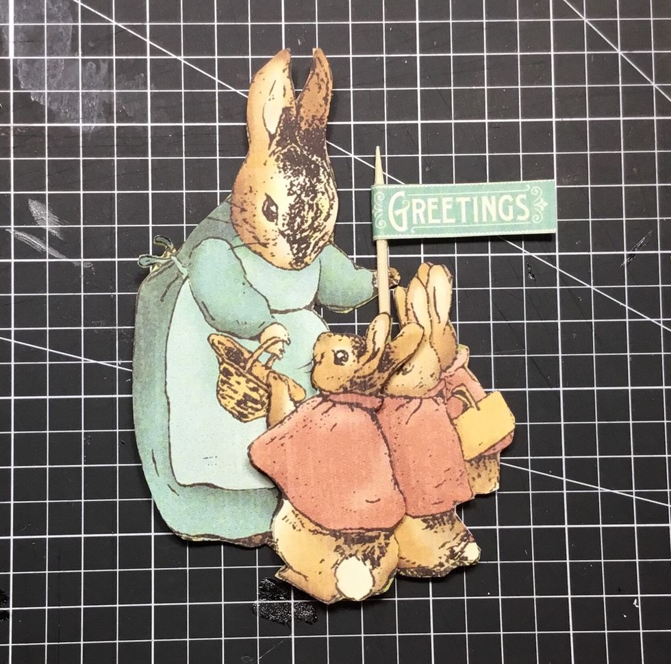 Attach mini sign post to the rabbit as shown.