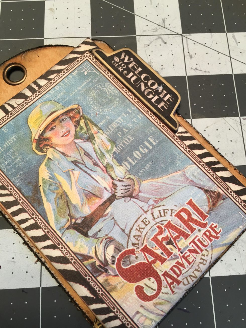 Attach on to the flap on the front side and allow to dry. This will be your tab to pull up on to open the flap on the front of the tag album.