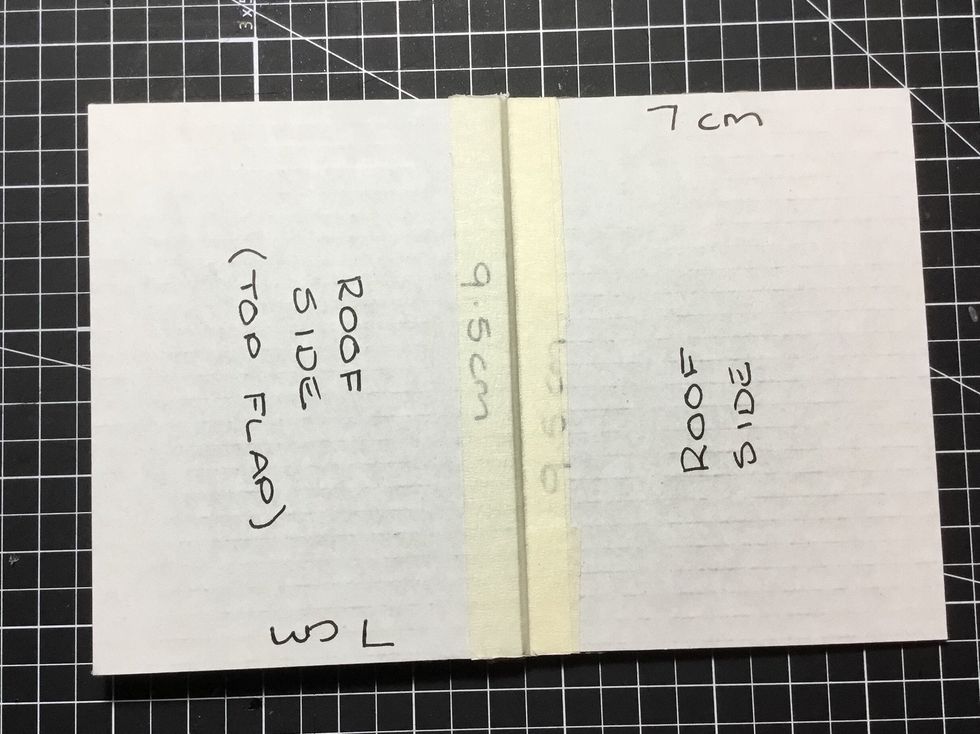 Attach on top of the roof as shown using masking tape. Attaching this will allow you to have a pop up roof.