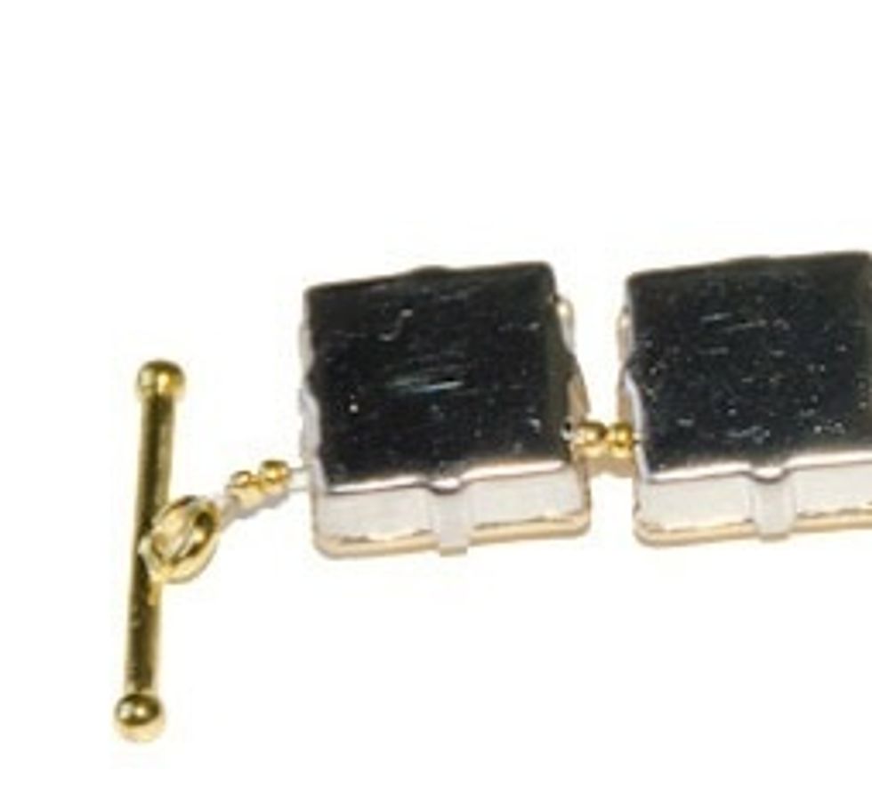 Attach one end of your clasp to your wire and add a crimp bead. Secure in place and begin stringing on your square rhinestone beads.