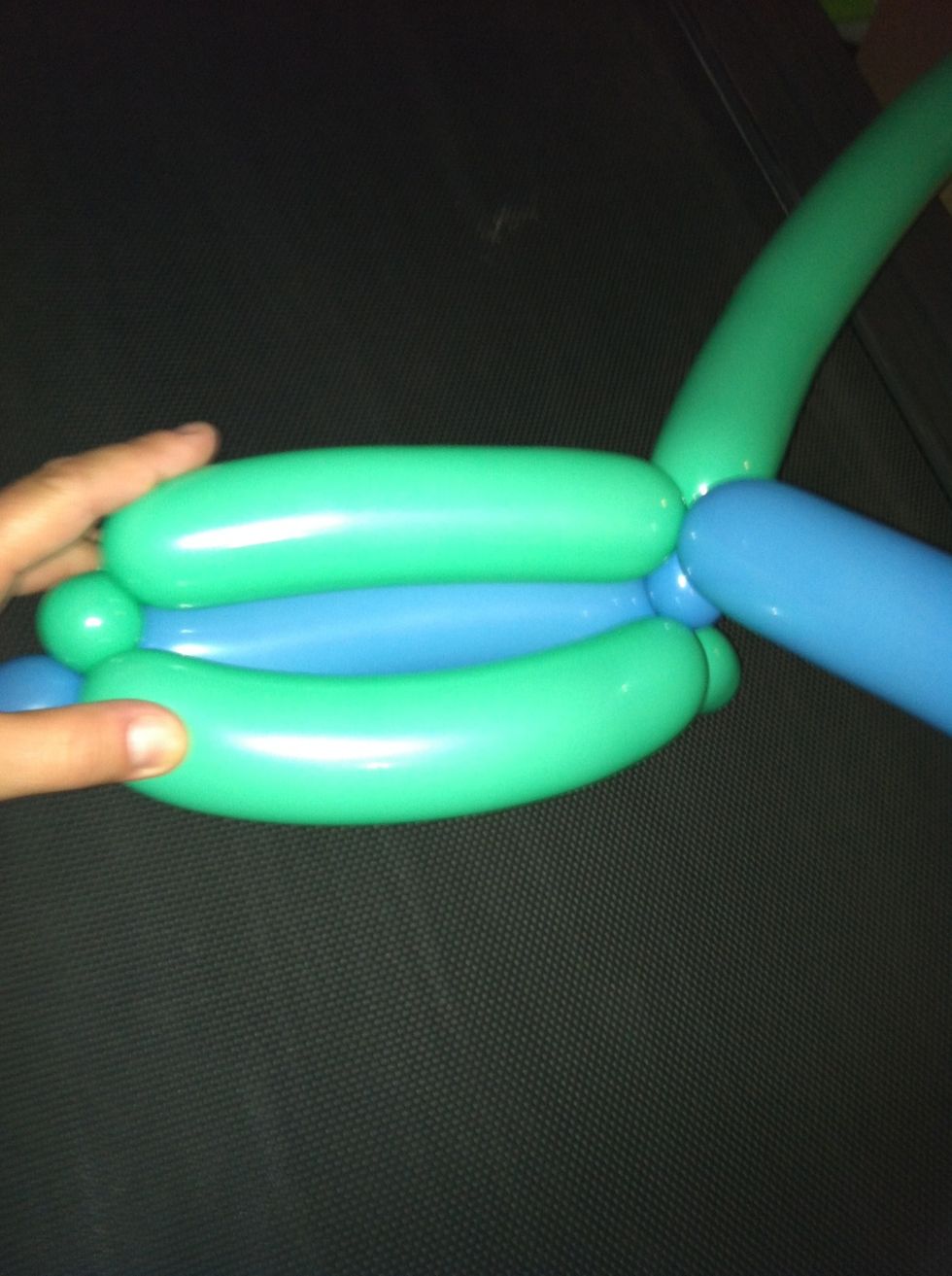 Attach one side to the other using the little bubble as the anchor point.