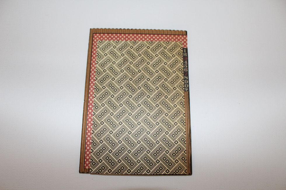 Attach one typography card to corrugated cardstock and attach with 3D foam adhesive the An Eerie Tale patterned paper