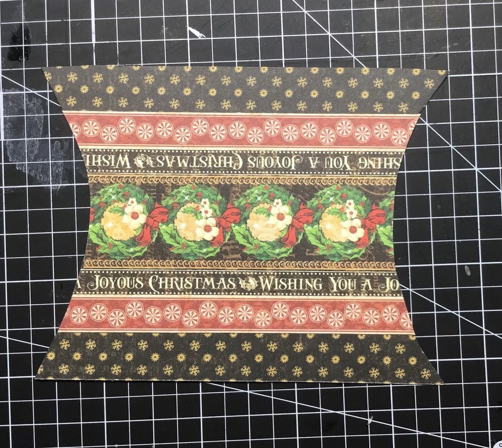 Attach paper strips as shown and trim edges to keep the shape.