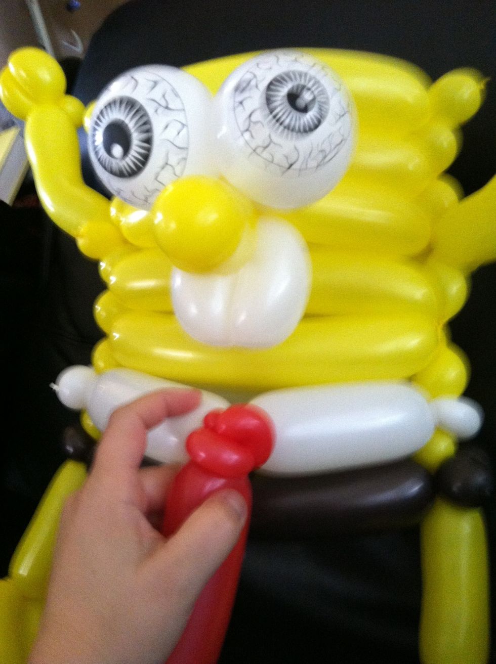 Attach red balloon to joint in white balloon