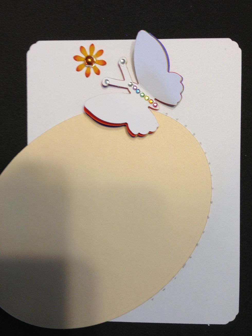 Attach rhinestones to butterfly and center to flower. Glue butterfly and flower in position at card top. Make pencil marks about 1/4 inch apart in an oval shape from butterfly to 1/2 inch from bottom.