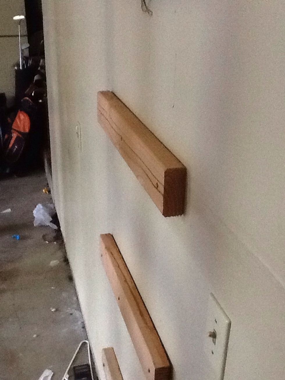 Attach similar braces to the wall at the same height. Again use a level to make sure your braces are at the accurate height and straight.