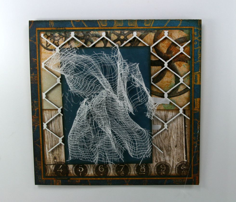 Attach small length of cheesecloth with glue gun. Pull ends to ravel slightly.