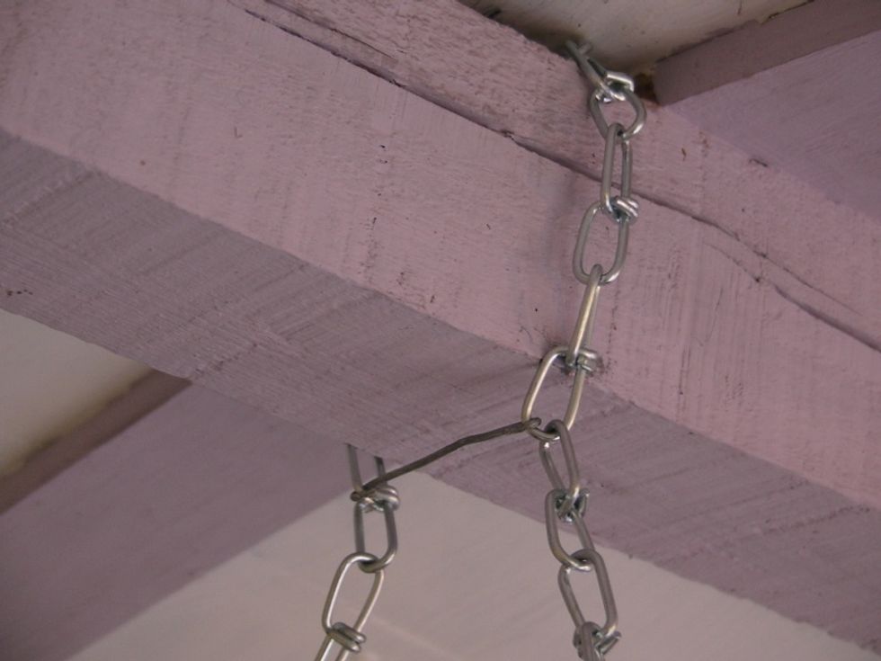 Attach the 2 chains from their center to your ceiling. We have a beam we can encircle. You may have to find a joist to screw into. Make sure you use something strong and secure (lag screw or hook)