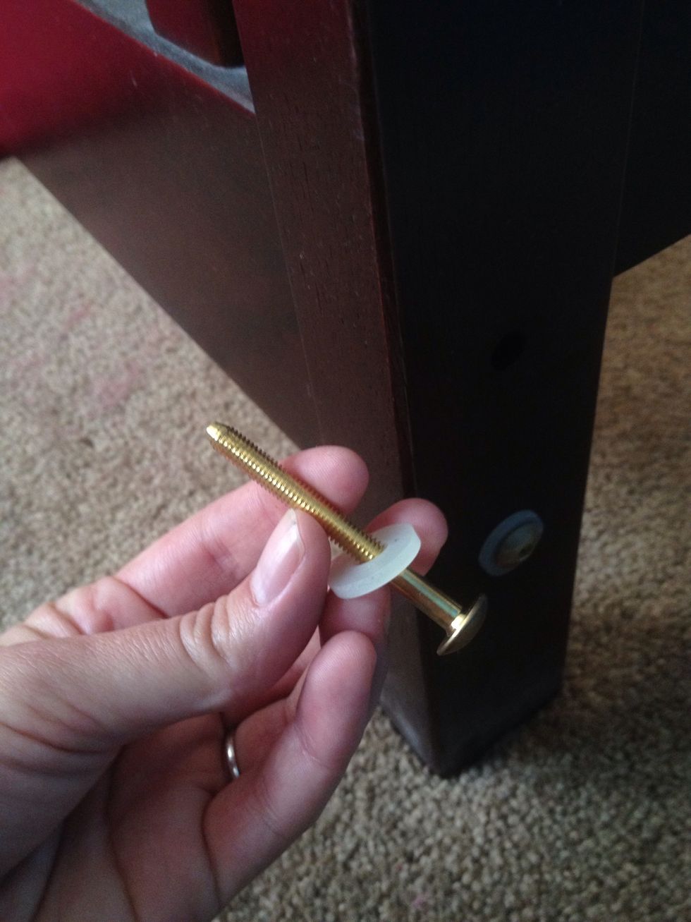 Attach the back panel to the side panels using these shorter bolts with washers.