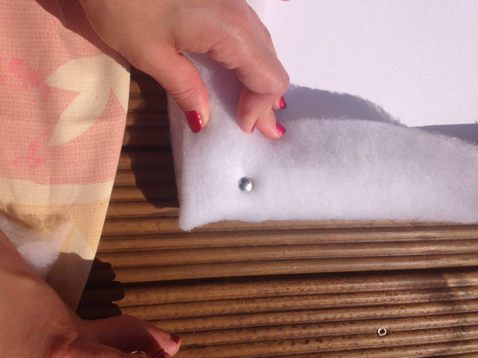 Attach the batting to each corner using drawing pins.