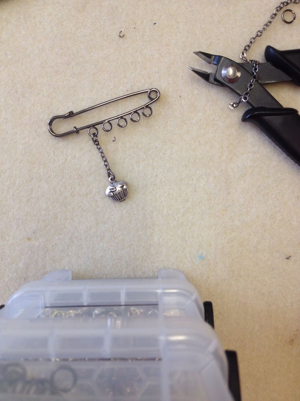 Attach the beads and charms as you go