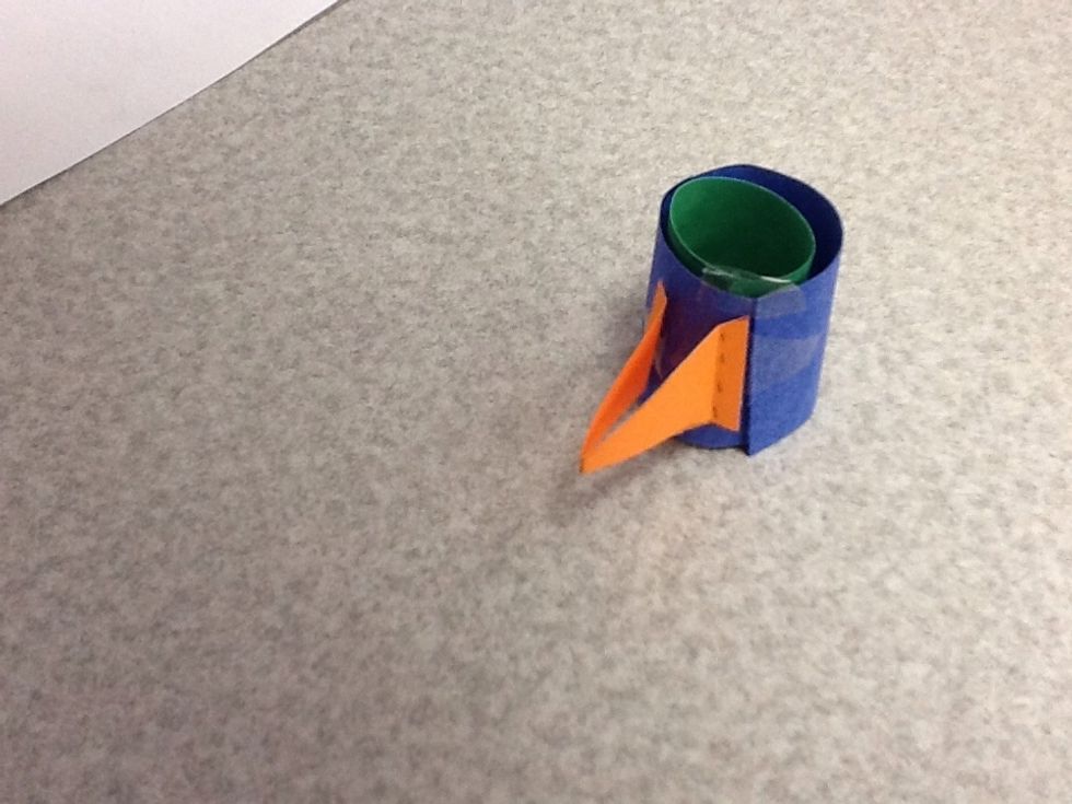 Attach the beak to the head with little tape pockets