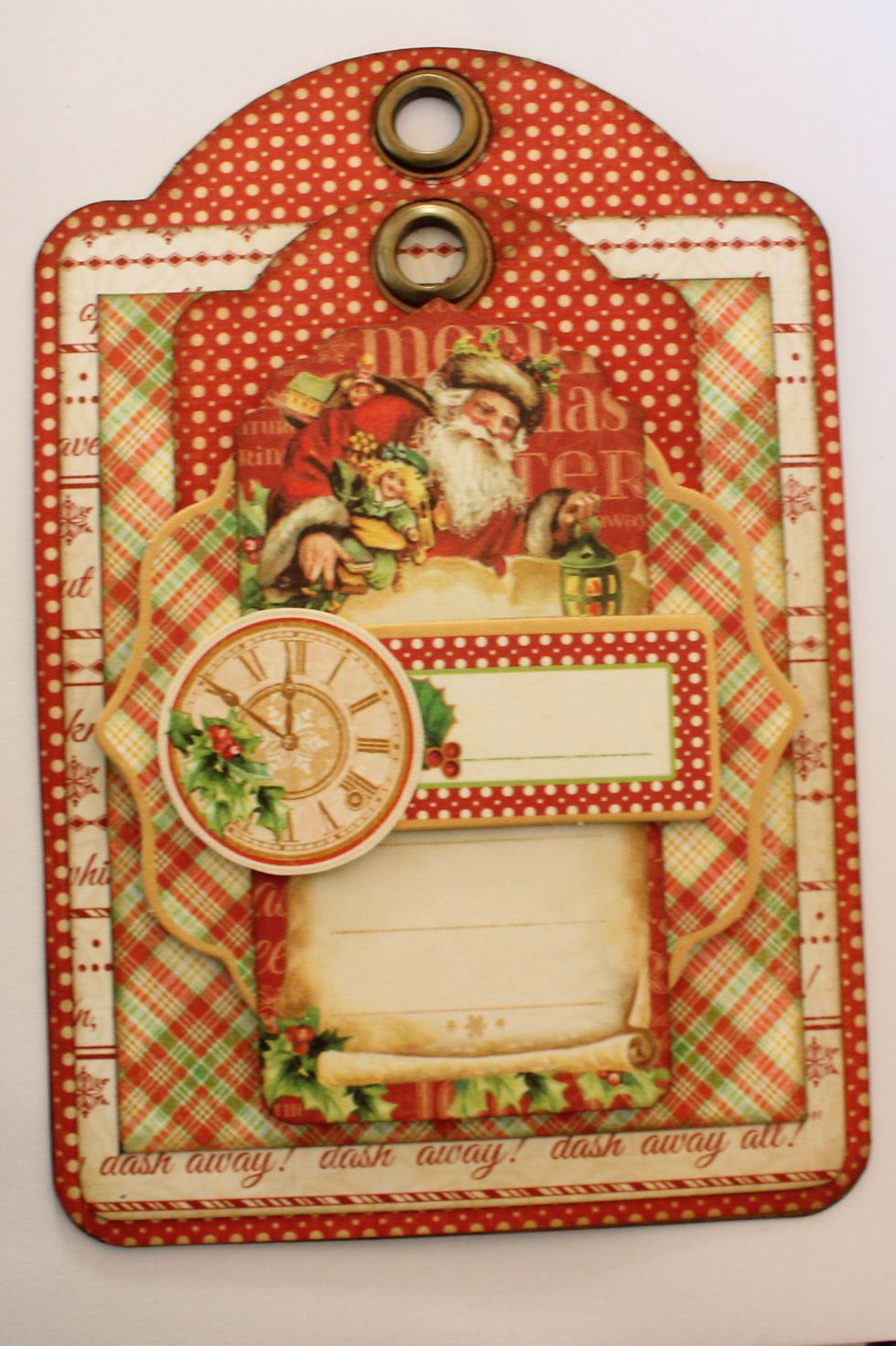 Attach the chipboard embellishment and the clock onto the tag.