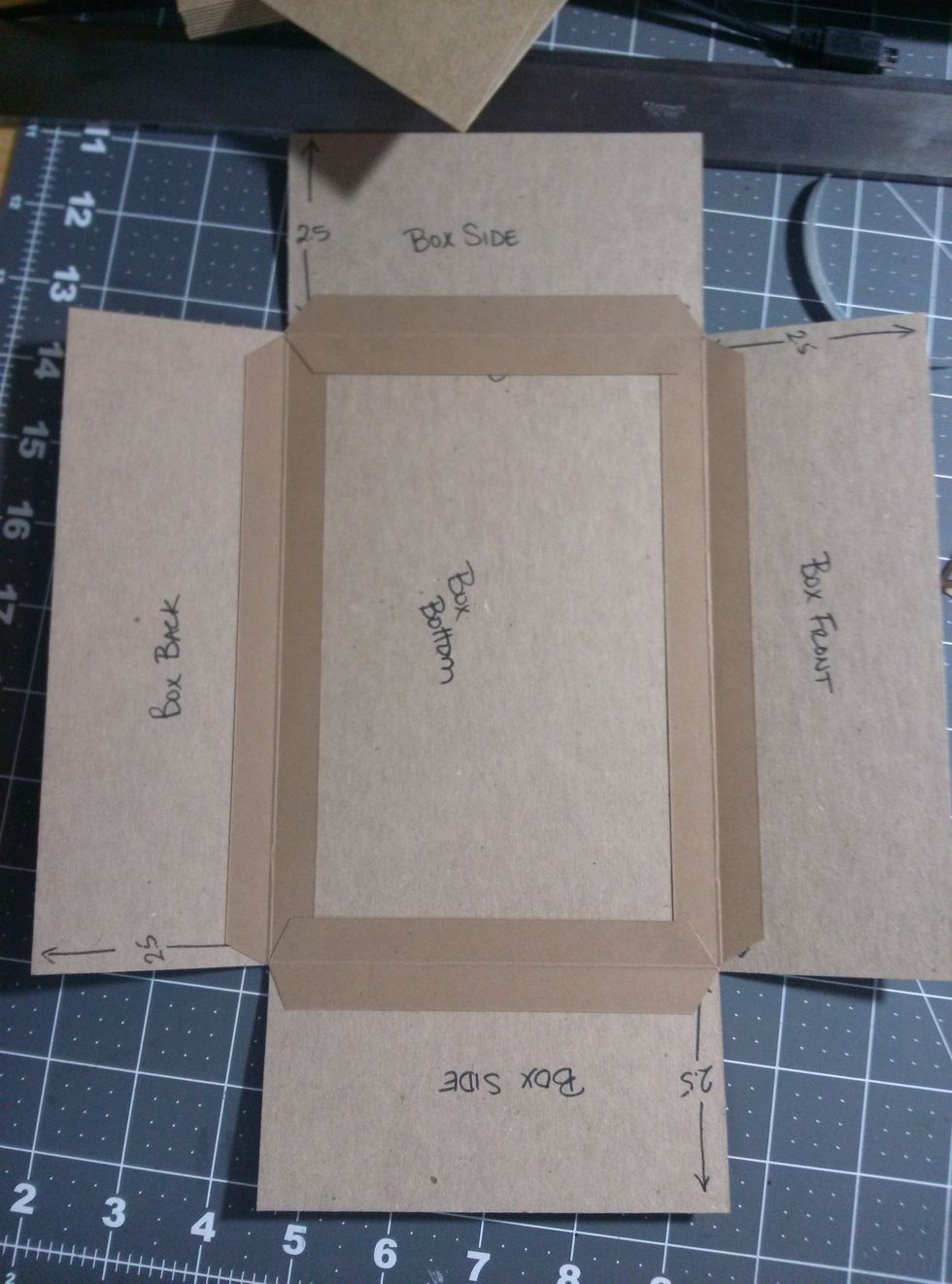 Attach the chipboard sides of box to the bottom of the box with construction strips