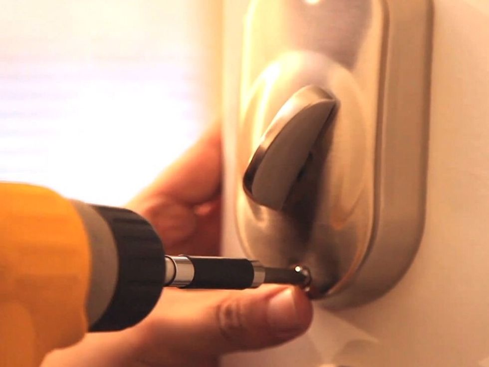 Attach the deadbolt cover with the provided screws.