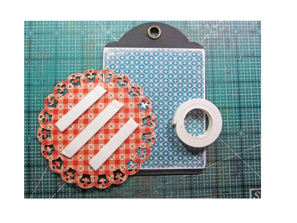 Attach the die cut to the base tag using foam tape.
