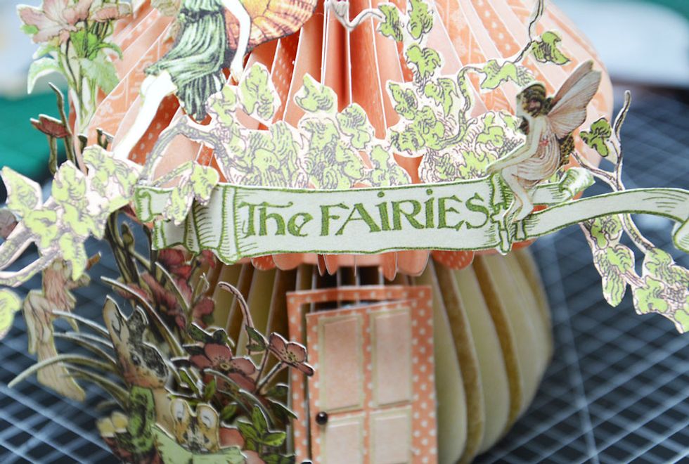 Attach 'The Fairies' title to the front of the roof above the door. PLEASE NOTE - I have added extra fussy cut foliage to the roof area but it is not required.