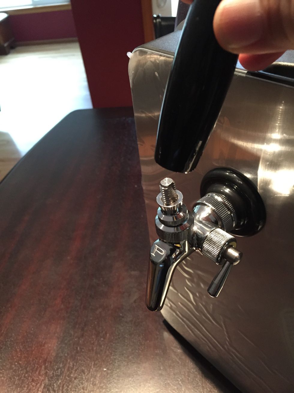 Attach the handle. It should move freely back and forth. The small handle on the side is a float valve to control the flow of beer. It's a good idea to keep it closed when not pouring.