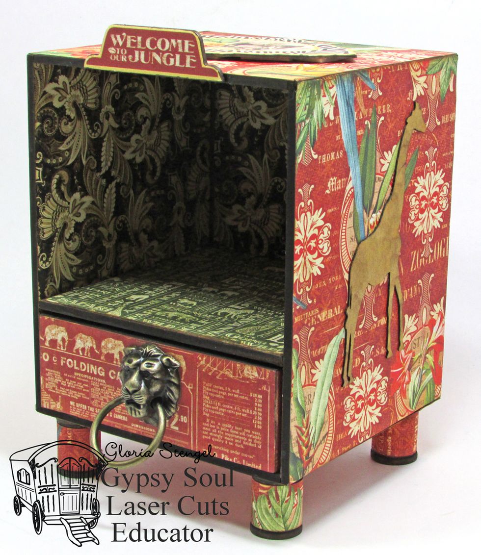 Attach the handle to the drawer. Glue the spools to the bottom of the display case.